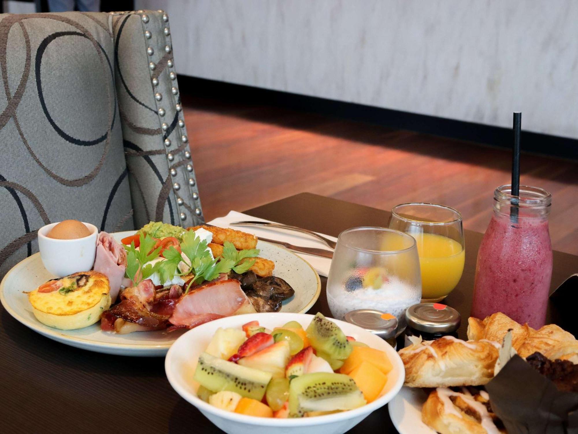Pullman Brisbane Airport Hotel Exterior photo A selection of breakfast items