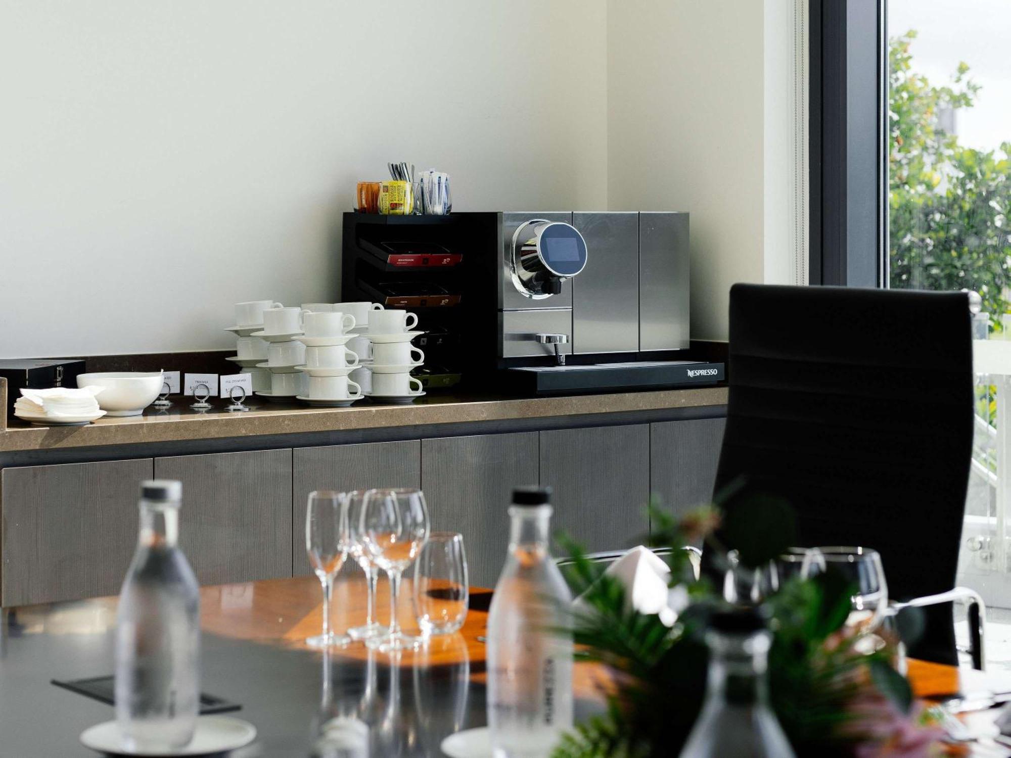 Pullman Brisbane Airport Hotel Exterior photo A coffee machine in a meeting room